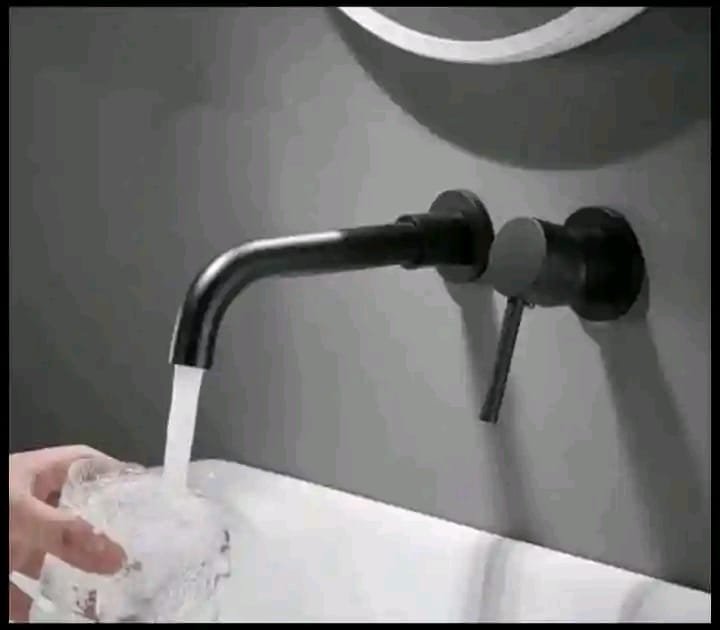 Wall-mounted tap fitted during a bathroom plumbing job